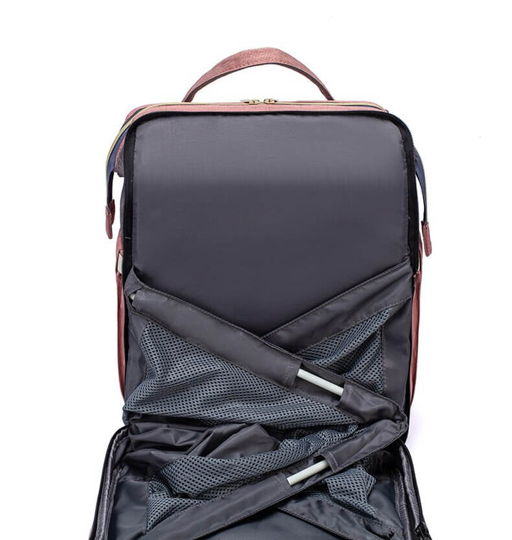 Unisex stelleveske/reiseveske med mange lommer; integrert babyseng for organiserte foreldre på tur.