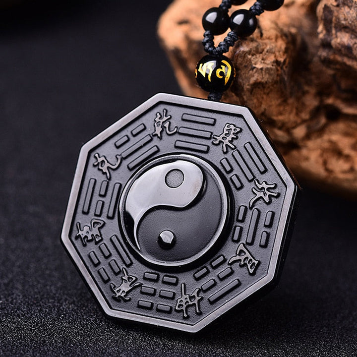 Kraftfullt obsidian yin yang smykke. Fremmer positiv energi og åndelig beskyttelse.