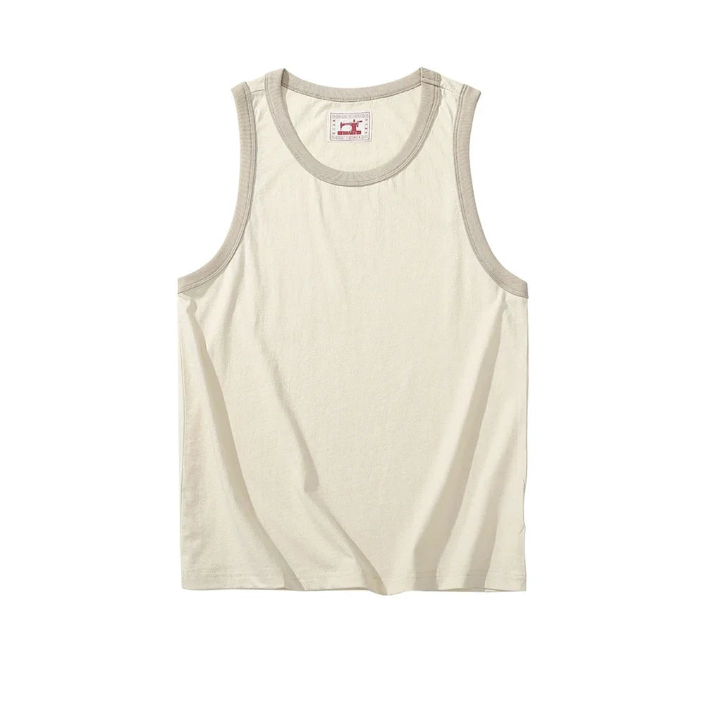 Vintage-inspirert herre tanktopp med oversized snitt. En trendy ermeløs topp for streetwear og avslappet bruk.