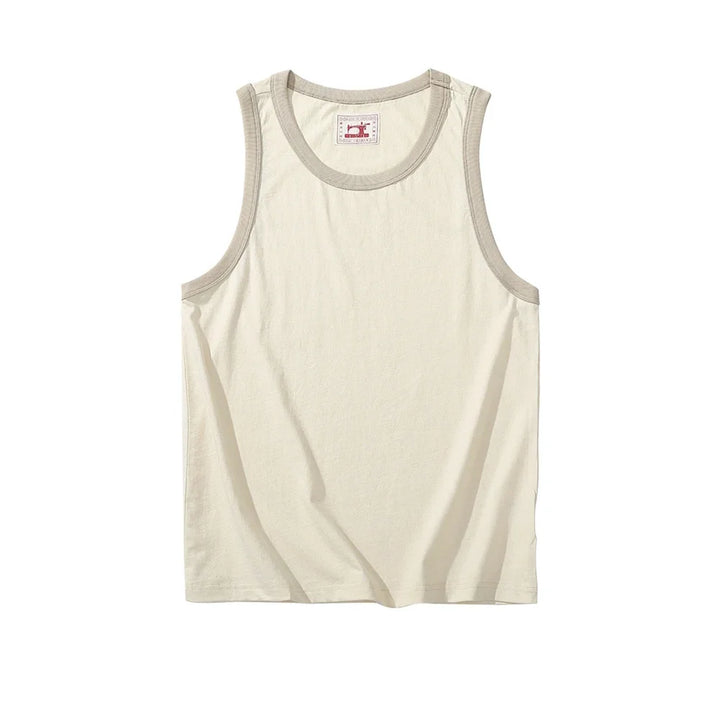Vintage-inspirert herre tanktopp med oversized snitt. En trendy ermeløs topp for streetwear og avslappet bruk.