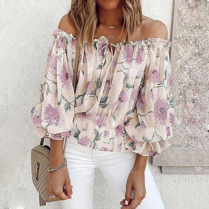 Kvinner blomstret off-shoulder bluse med volanger, elegant sommerstil og løs passform.