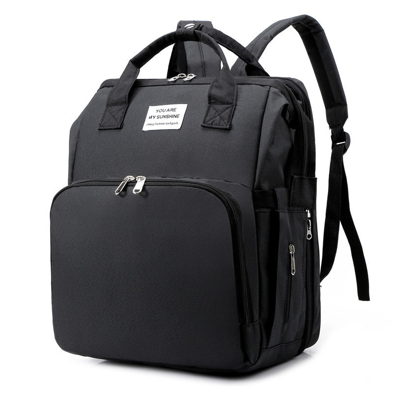 Multifunksjonell reiseveske med integrert babyseng, perfekt for babyreise og foreldre. Inkluderer stellematte.