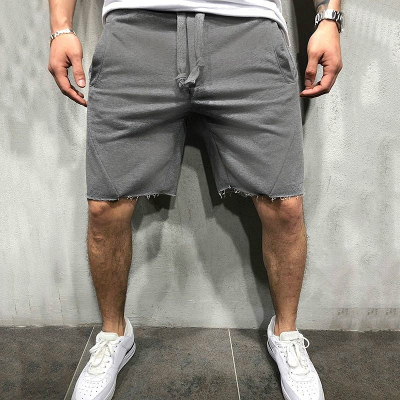 Ensfargede herreshorts med løs passform; garanterer komfort og stil i varmen.