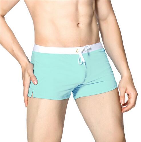 Menns hurtigtørkende badeshorts, komfortabelt ensfarget svømmetøy for sommer.
