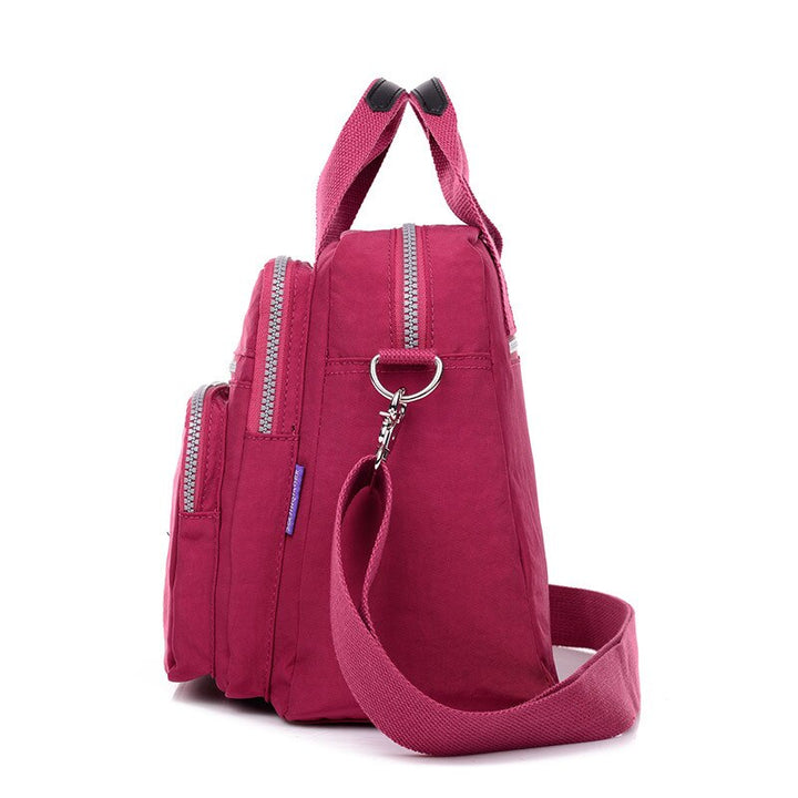 Crossbody-veske for kvinner, vanntett og slitesterk for utendørsaktiviteter.