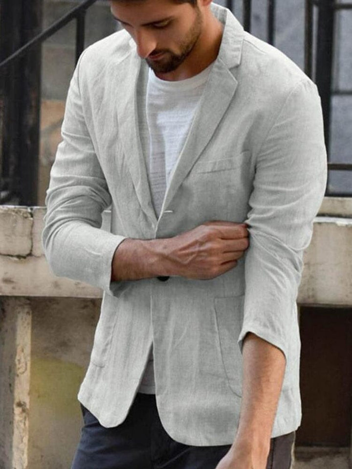 Elegant herreblazer i ensfarget design, perfekt for stilfull og uformell herremote.