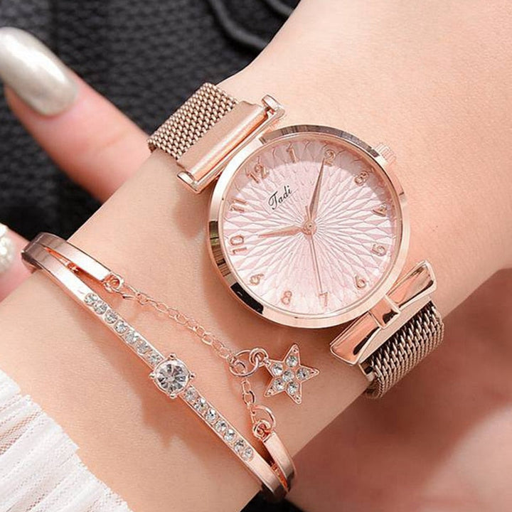 Stilfullt armbåndsur for damer med glitter skive og justerbar magnetrem, et trendy tilbehør.
