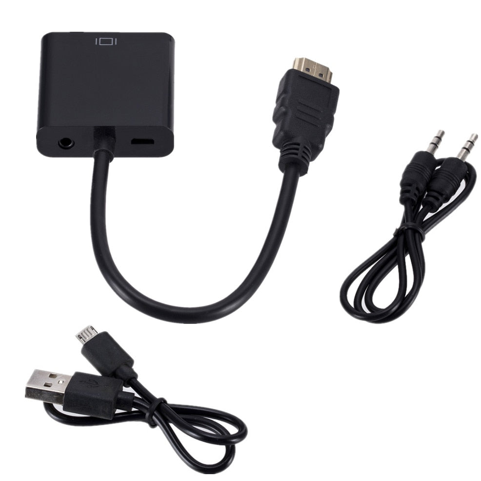 Bærbar PC koblet med HDMI til VGA-adapter, som viser bilde på en eldre VGA-monitor.