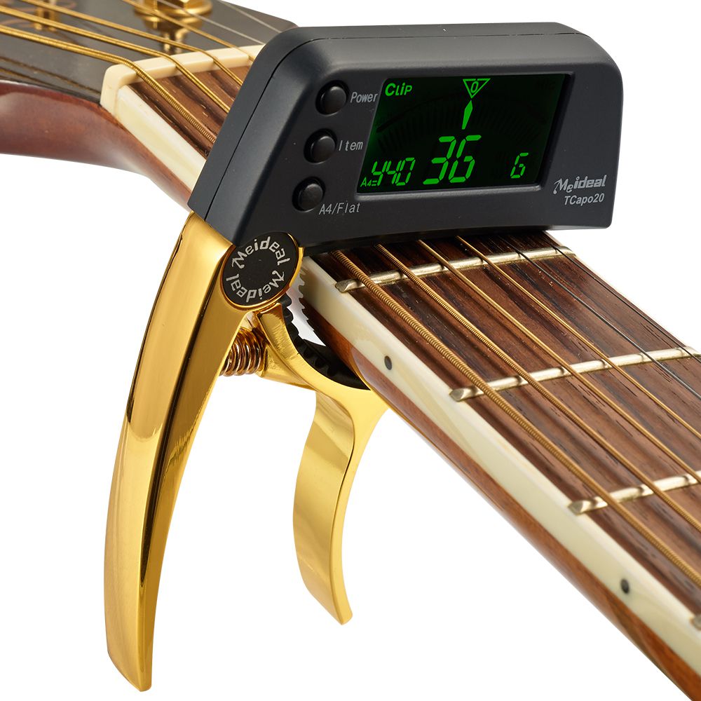 Digital gitar tuner og capo i ett, sikrer nøyaktig stemming for gitar, bass, og ukulele tilbehør.
