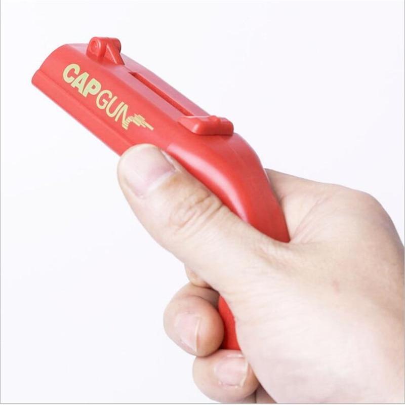 Praktisk kjøkkenutstyr: Flaskeåpner med korkpistol-funksjon. Perfekt gadget for underholdning.