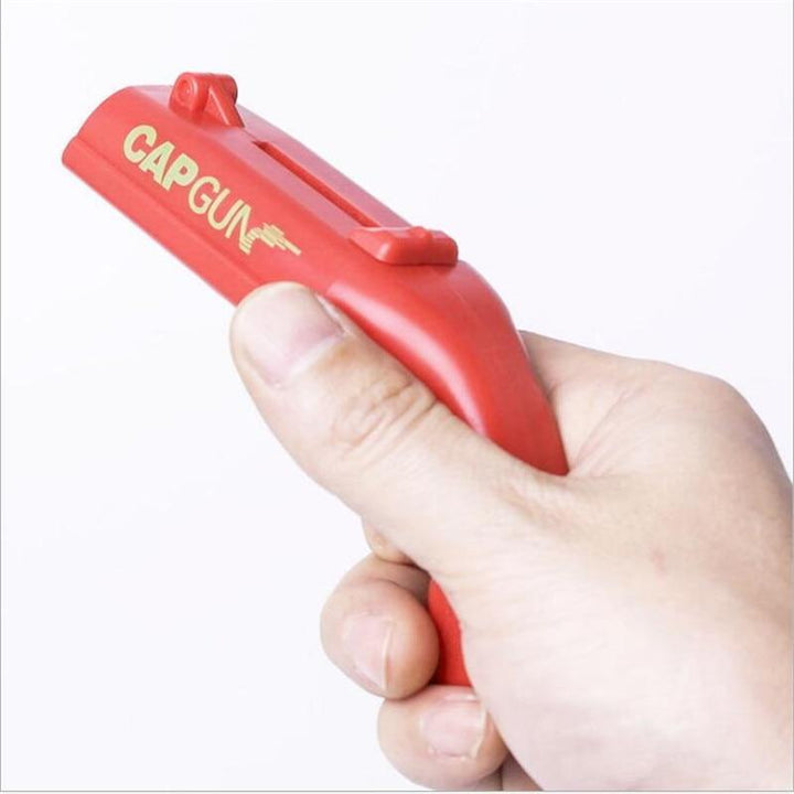 Praktisk kjøkkenutstyr: Flaskeåpner med korkpistol-funksjon. Perfekt gadget for underholdning.