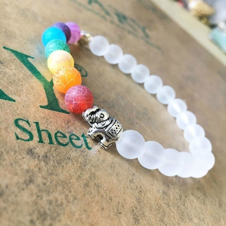 Elegant Kvinner 7 Chakra armbånd med elefant detalj. Krystaller fremmer energi og indre balanse.