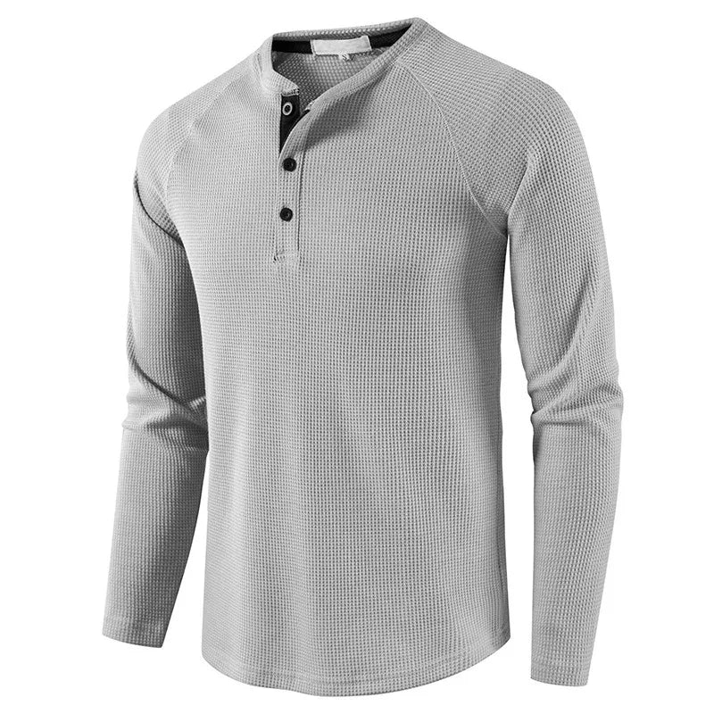 Herre t-skjorte: langermet Henley, vaffelstruktur, bomull, slim passform for en casual vårstil.