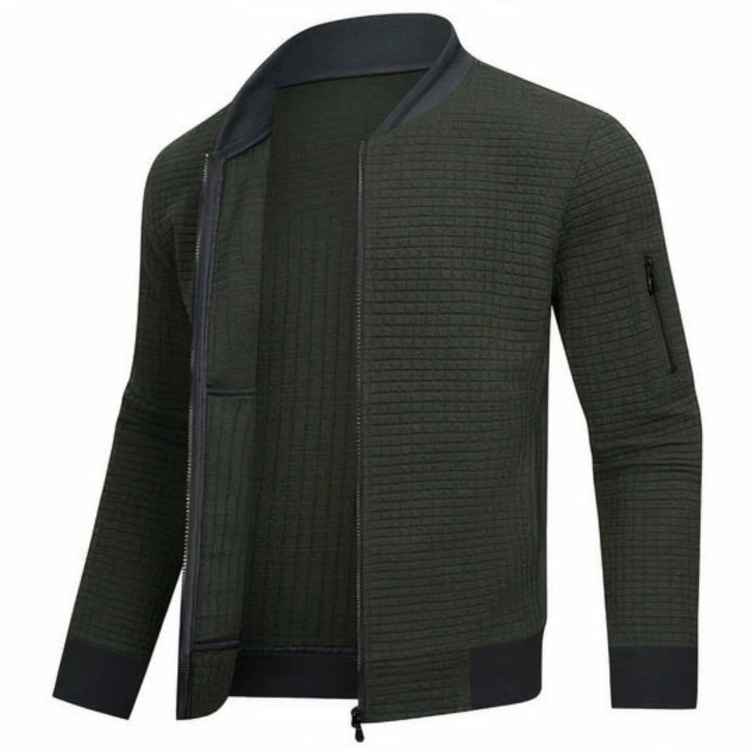Mann iført en stilig og komfortabel monokrom bomberjakke, perfekt for en moderne og casual hverdagsstil.