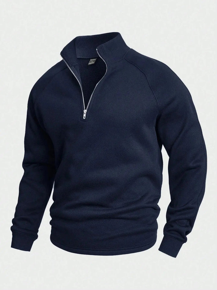 Halv-zip genser for herre. Tidløst design i slitesterk bomullsmiks for langvarig bruk.