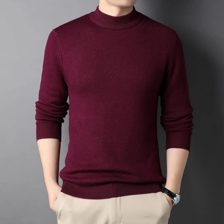 Myk og behagelig herregenser med halvpolo krage. Stilren slim-fit, perfekt for kalde dager.