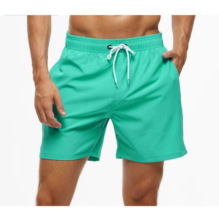 Herre badeshorts med lommer, hurtigtørkende og funksjonelle for strand og sommeraktivitet.