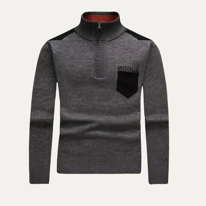 Komfortabel herre ullgenser, halv zip med stilrent patchwork i imitert semsket skinn.