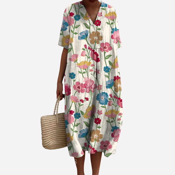 Kvinner kjole: Blomstrete design, V-hals og korte ermer. Ideell som elegant og avslappet sommerkjole.