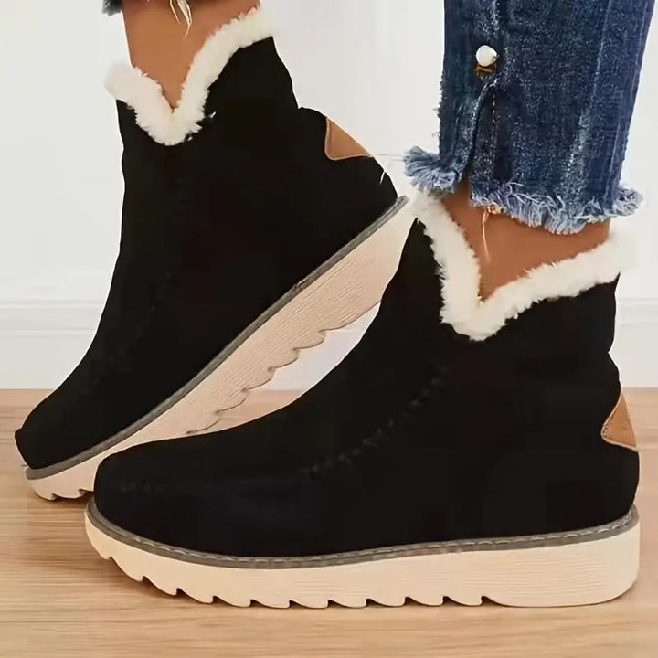 Svarte dame vinterstøvler, komfortable og stilige. Ideelle kvinneboots for vinterbruk, tidløs design.
