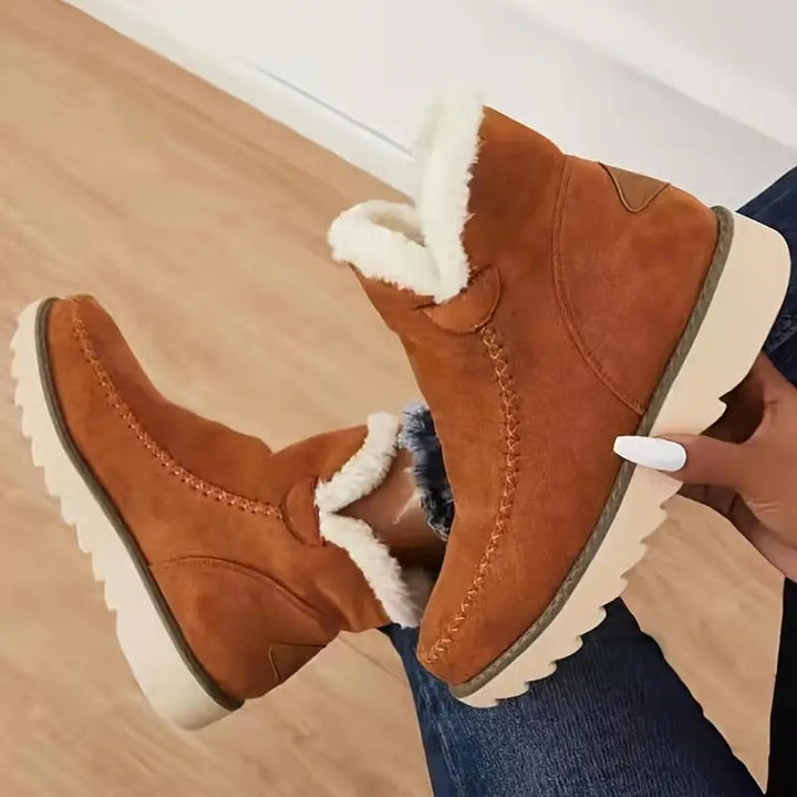 Elegante brune dame vinterstøvler. Varme, komfortable kvinneboots som kombinerer stil og funksjonalitet.