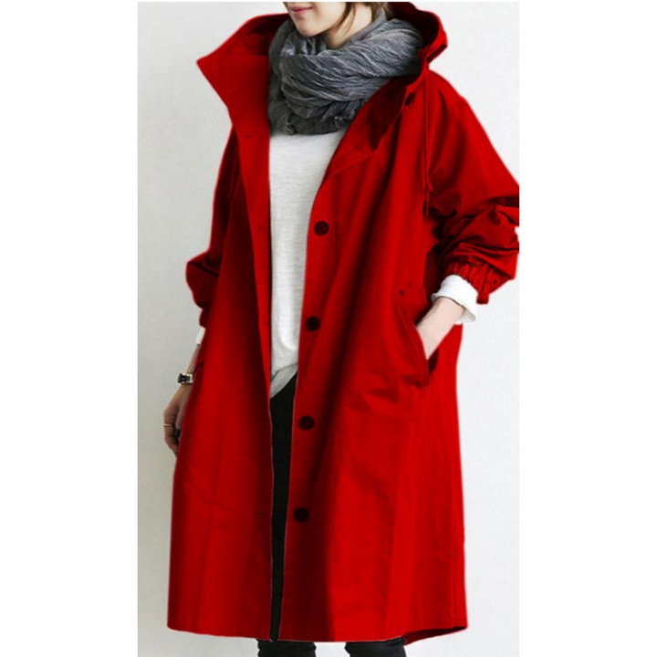 Tidløs kvinners lang kåpe med hette. Elegant trenchcoat som allsidig allværsjakke for urban stil.