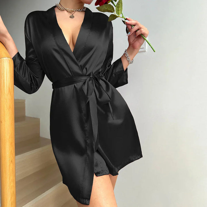Detaljbilde av stoffet på den myke, feminine morgenkåpen. Gir stilfull komfort og velvære.