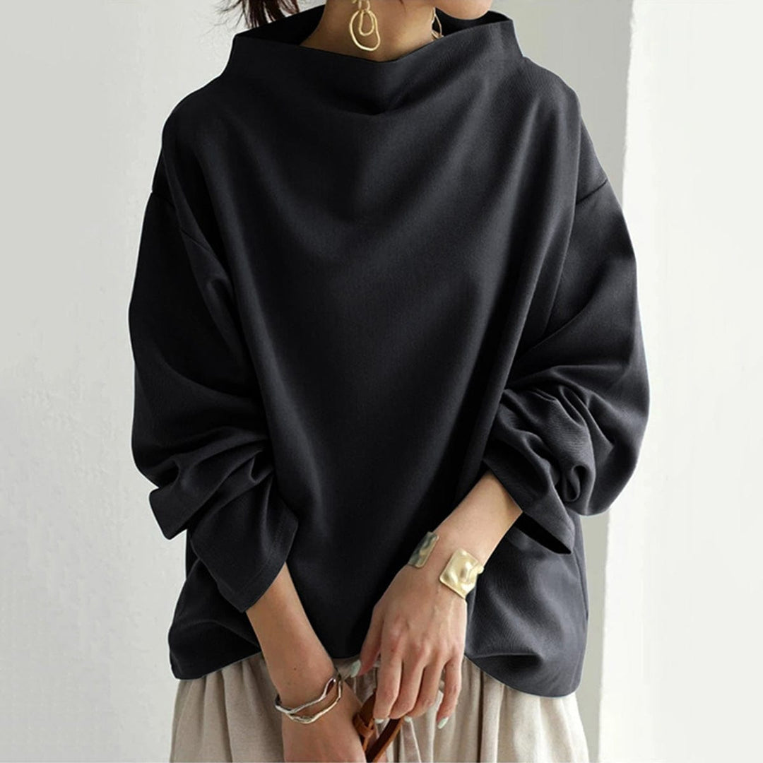 Stilfull langermet topp for kvinner. Høy hals, perfekt for en komfortabel og elegant hverdagslook.