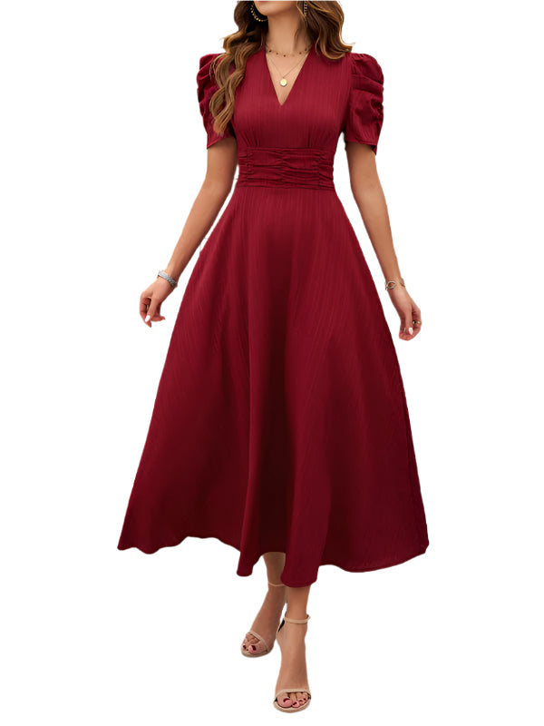 Elegant kvinners midi kjole med V-hals og trendy puffermer. Ideell vår-, sommer- og festkjole.