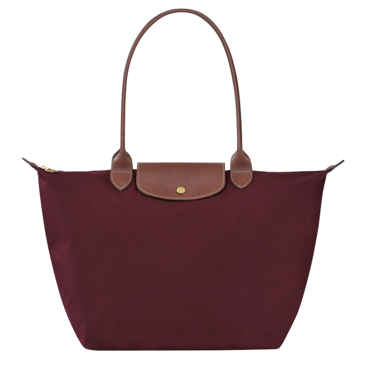 Kvinners store shopper veske med praktisk design, justerbar skulderstropp og romslig interiør.
