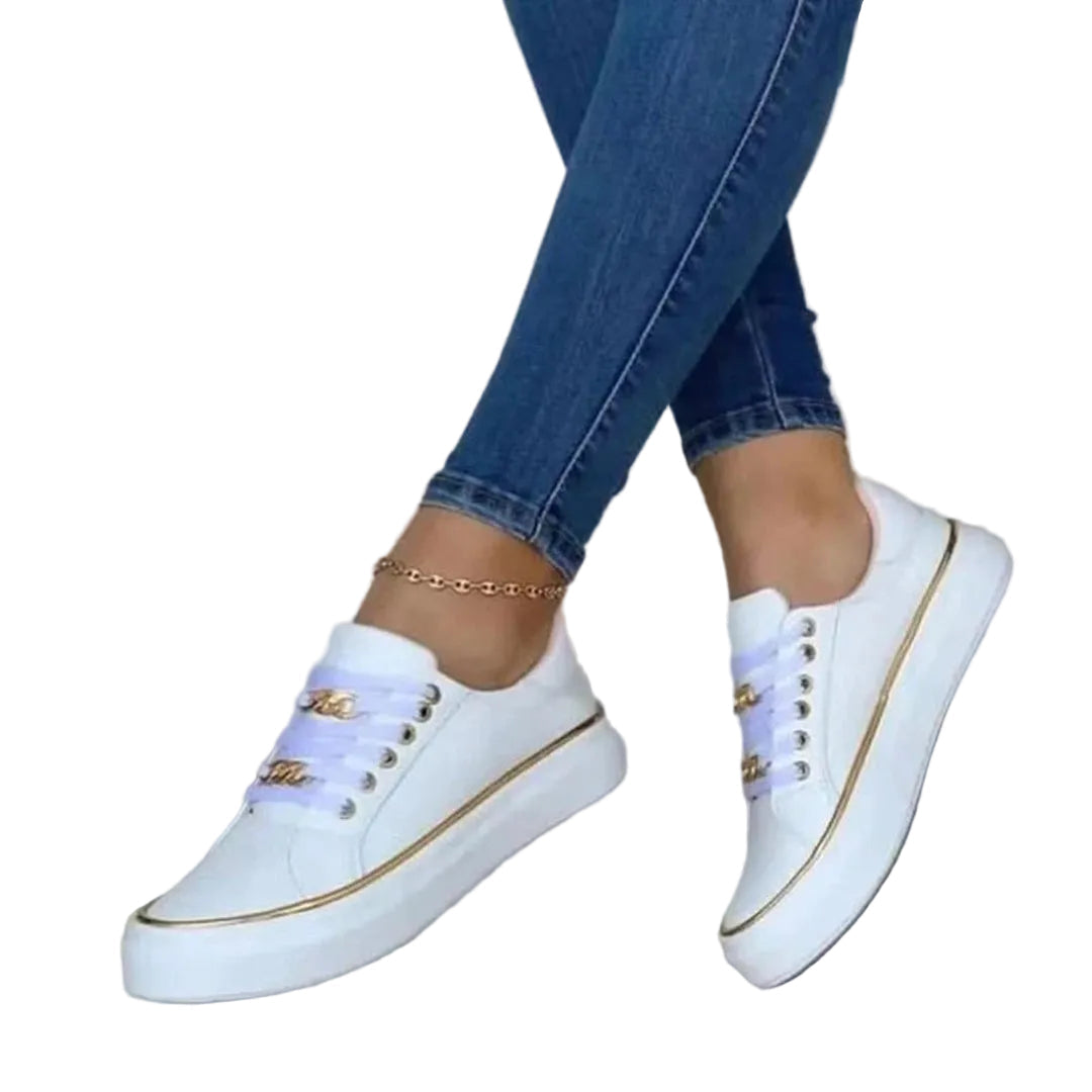 Moderne damesneakers med raffinert design, elegante gull detaljer og komfortabel passform. Allsidige fritidssko.