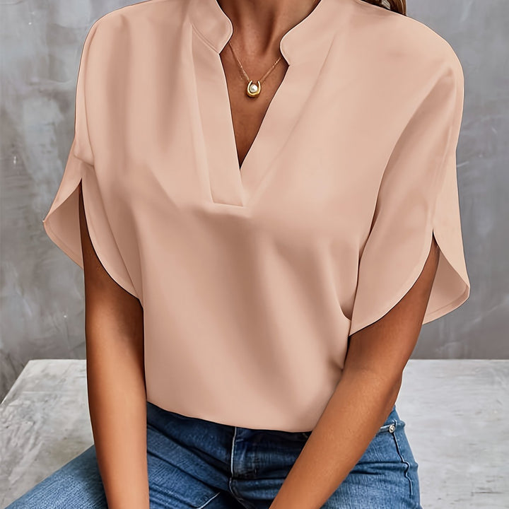 Stilren damebluse, elegant og lett, ideell for kontor og fest. Moderne og komfortabel.