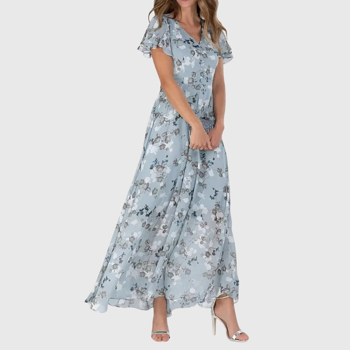 Stilfull blå flatterende kvinnekjole. En komfortabel festkjole eller elegant hverdagskjole for vår og sommer.