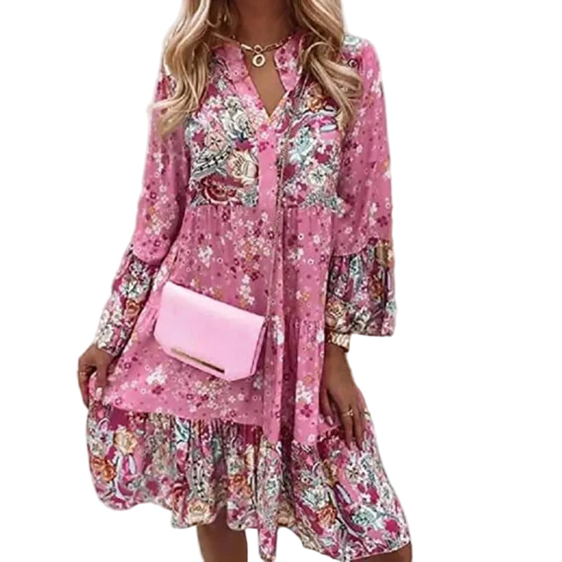 Kvinnesommerkjole med V-hals, livlig blomsterprint. Lettvekt polyester, komfortabel for hverdags eller sommerfest.