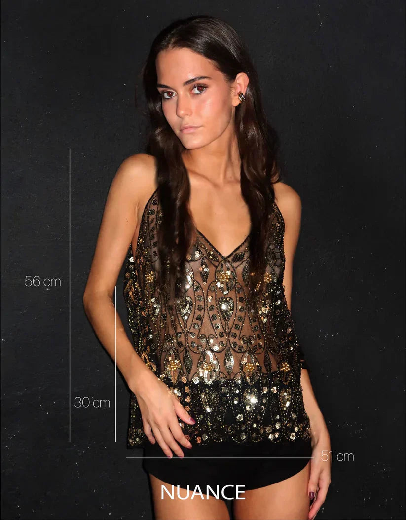 Kvinners glittertopp, designet for fest og glamour. Med skinnende paljetter og sofistikerte perledetaljer.