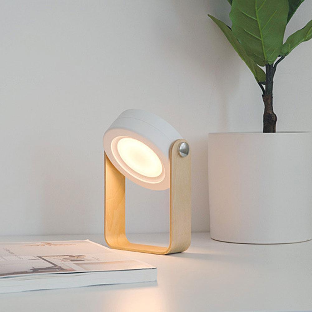 Stilig hvit/grå Foldy LED-lampe, 7-i-1, med roterbart håndtak, for moderne hjemmeinnredning.