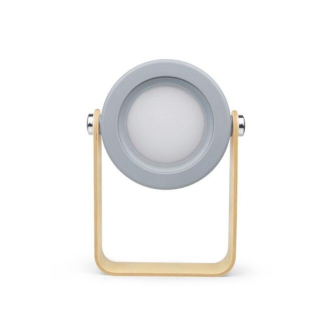 Bærbar Foldy LED-lampe, hvit/grå, med roterbart håndtak, ideell som camping- eller leselampe.