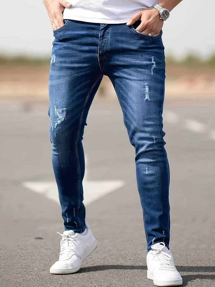 Stilige menns denim jeans med trendy rifter, casual og moderne look.