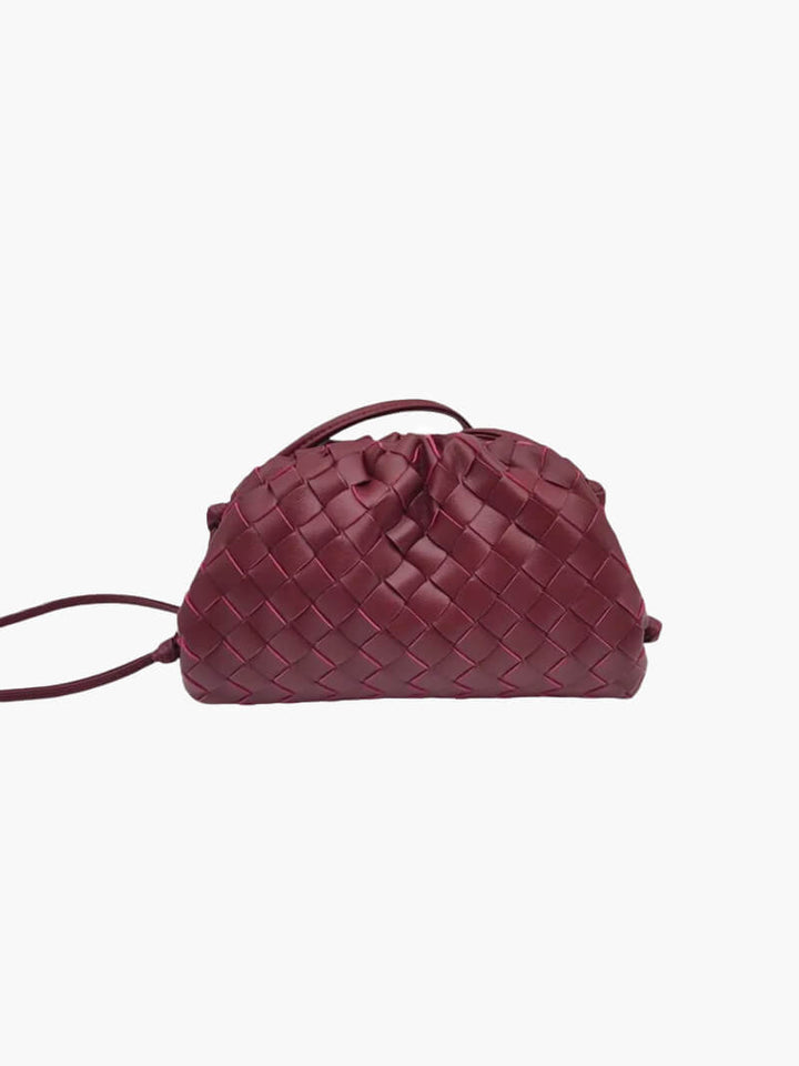 Bakside av elegant miniveske. Allsidig dameveske som skulderveske eller crossbody.