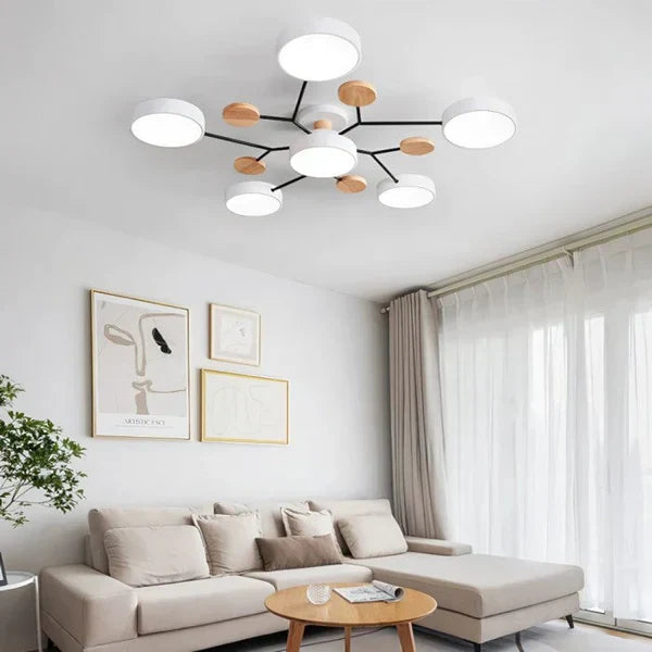 Hvit moderne LED-taklampe med justerbare lyspunkter, ideell for stue og dynamisk belysning.