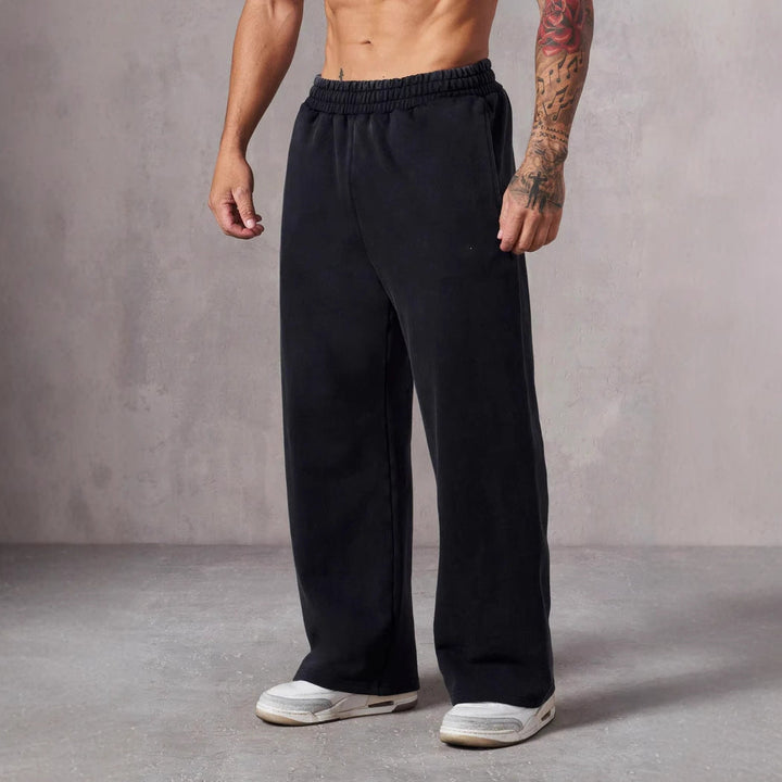 Behagelige joggebukser for herre med vid passform og elastisk midje, flotte for både trening og avslapning.