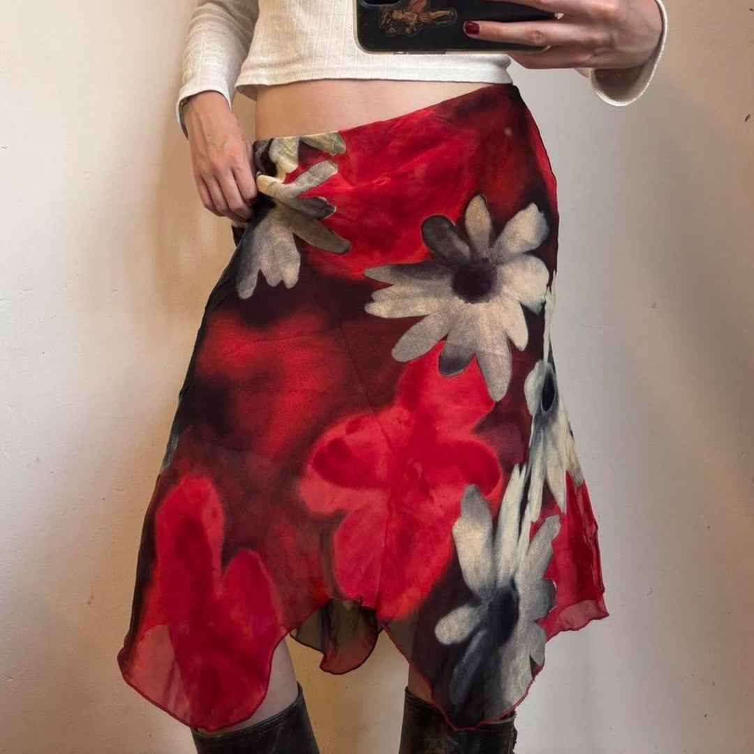 Stilfullt blomstret midi skjørt, ideelt som elegant festskjørt eller komfortabelt hverdagsskjørt.