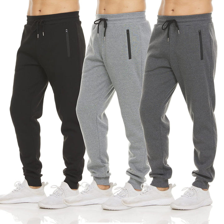 Mørkegrå herre joggebukse med glidelåslommer og justerbar midje, perfekt for sport og fritid.