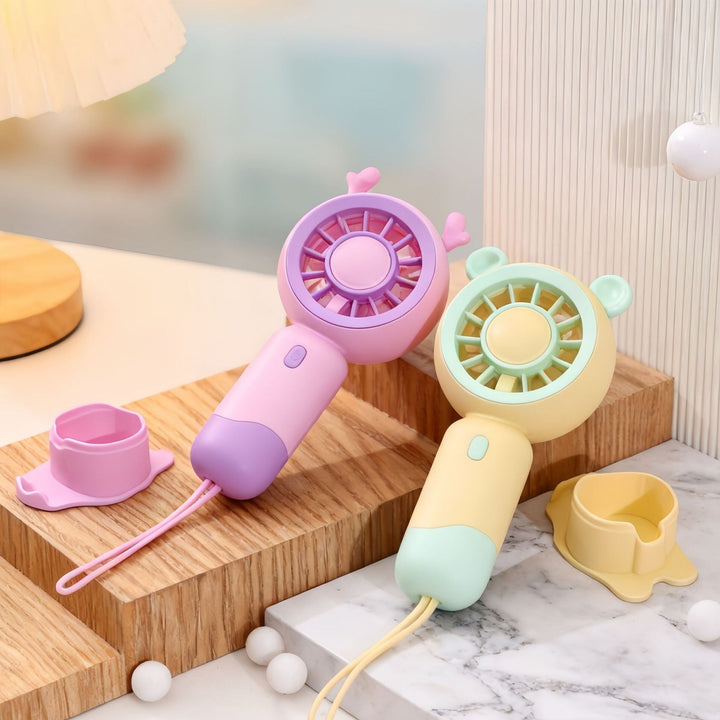 USB-ladbar mini vifte med katt, reisevennlig for kjølige dager.