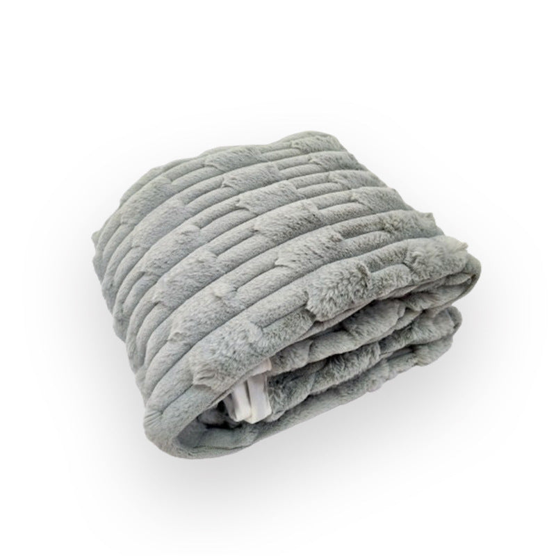 Elegant grått kosepledd med strukturert overflate, flott dekorasjon for moderne stuer og soverom.