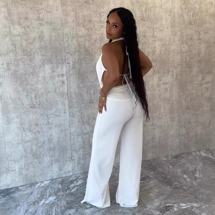 Komfortabel dame jumpsuit med v-hals og vide ben, allsidig for formelle og uformelle anledninger.