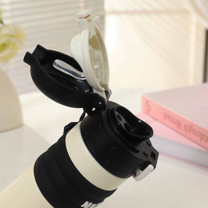 Isolerende 520ml drikkeflaske med søtt design. Hvit unisex termos med bæresnor, holder drikken kald eller varm, BPA-fri.
