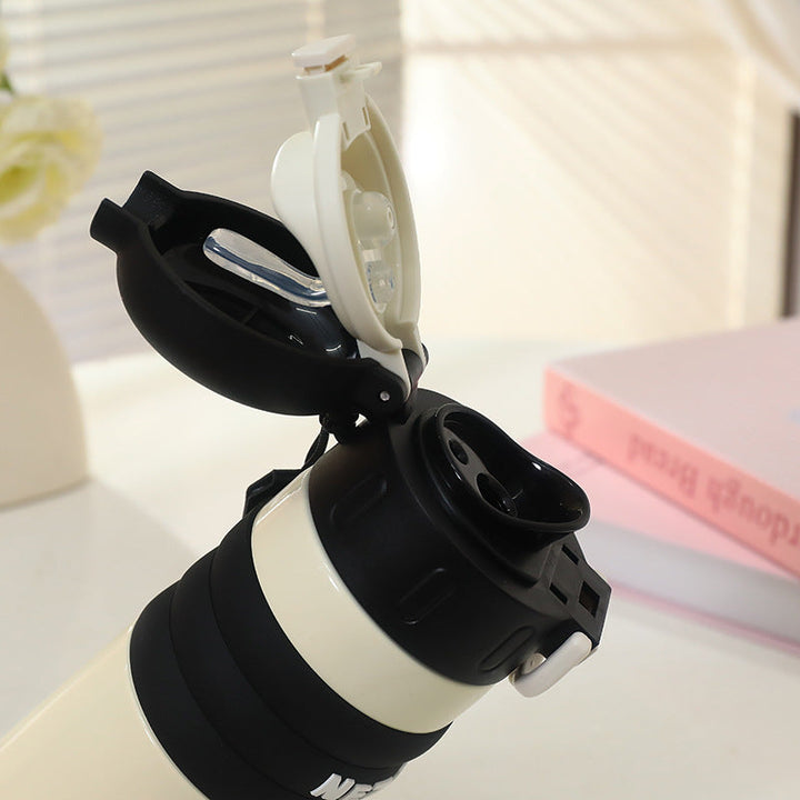Isolerende 520ml drikkeflaske med søtt design. Hvit unisex termos med bæresnor, holder drikken kald eller varm, BPA-fri.