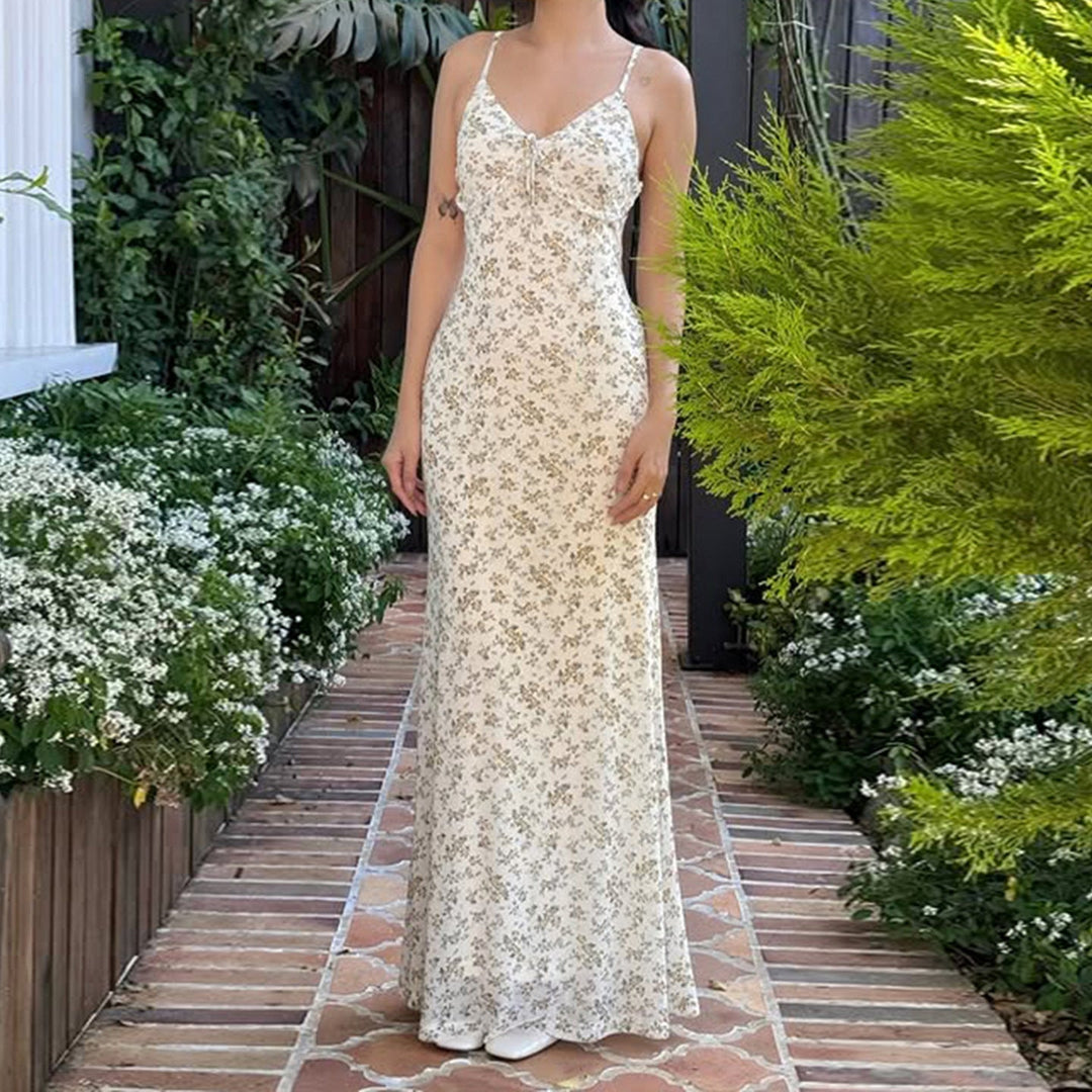 Lys gul blomstret A-linje dame sommerkjole. Elegant stroppekjole, perfekt for solfylte dager og sommerfest.