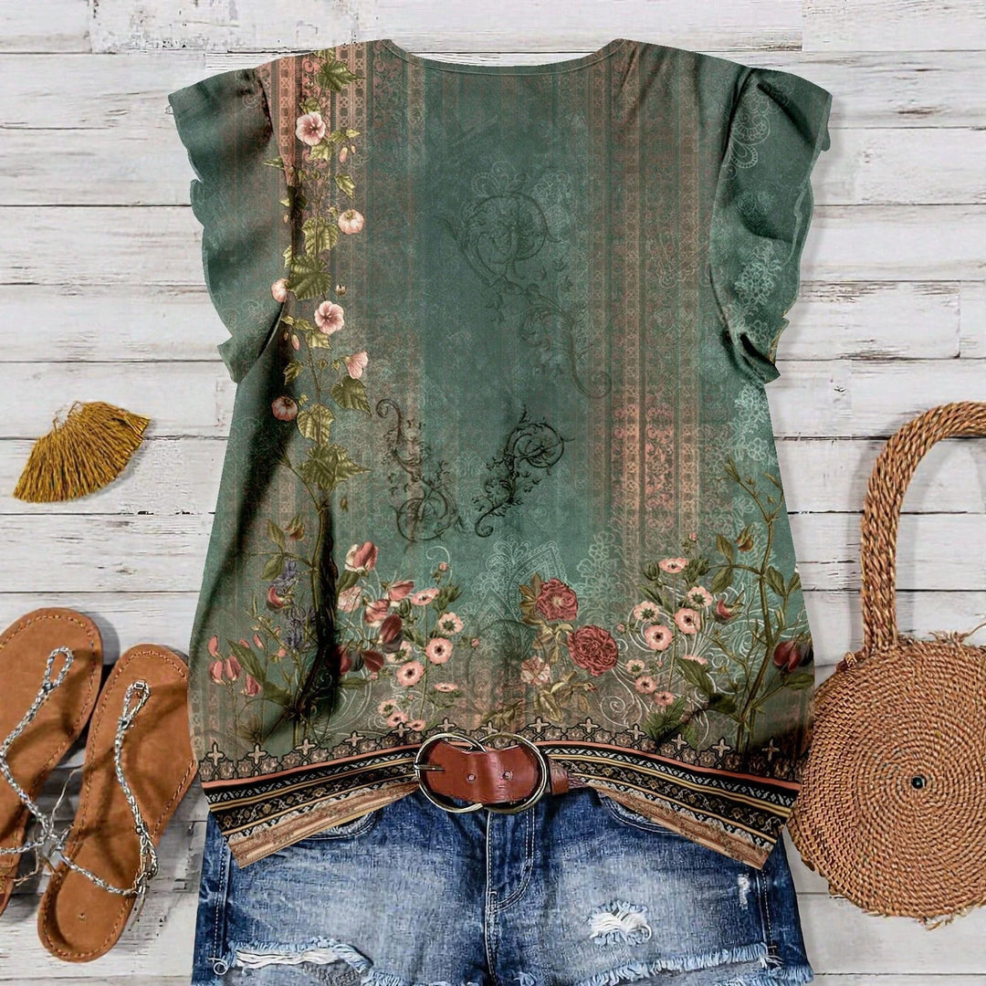 Feminin sommerbluse med blomster og elegant V-hals; en komfortabel topp for fritid.
